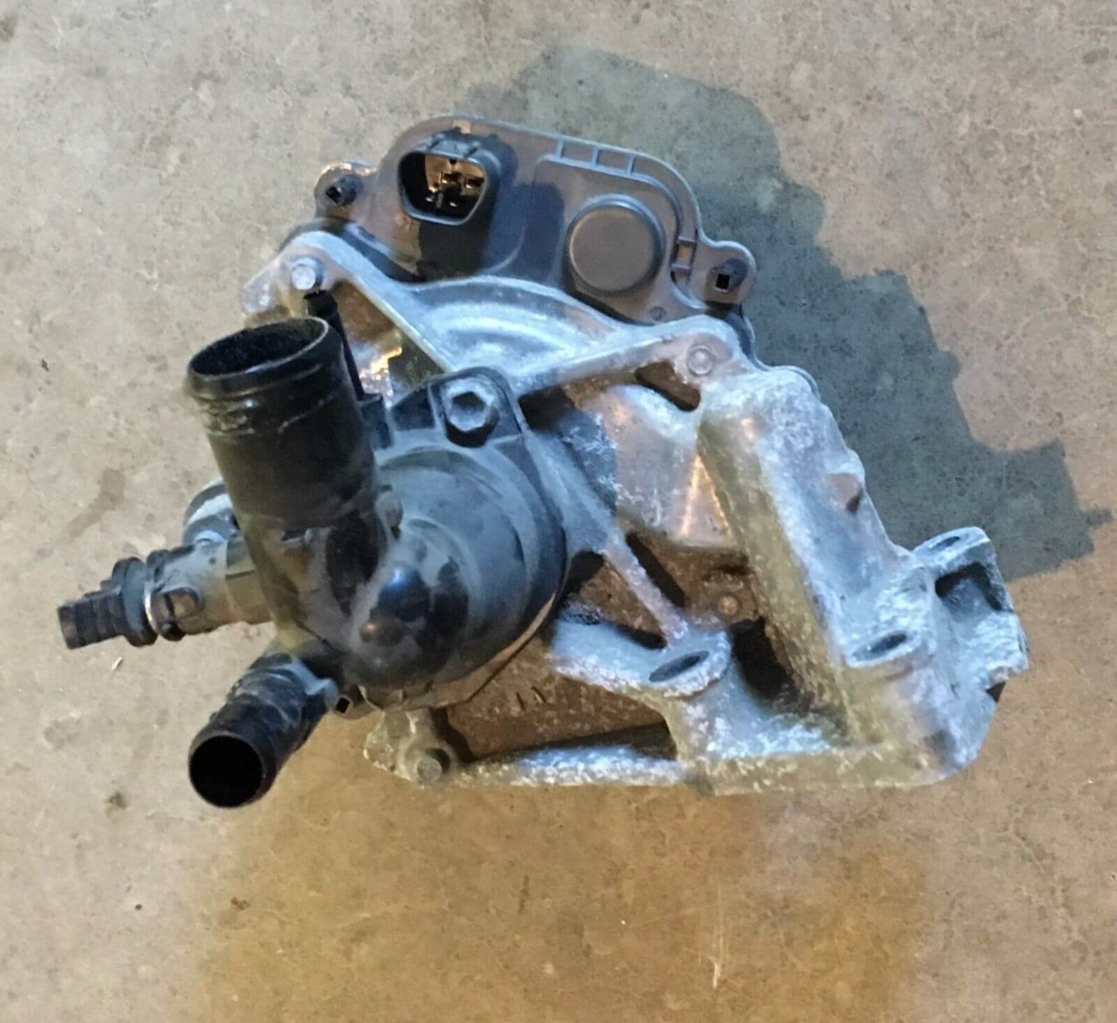 Used OEM 2012-2014 Toyota Prius C Water Pump with Coolant Thermostat Housing OEM
